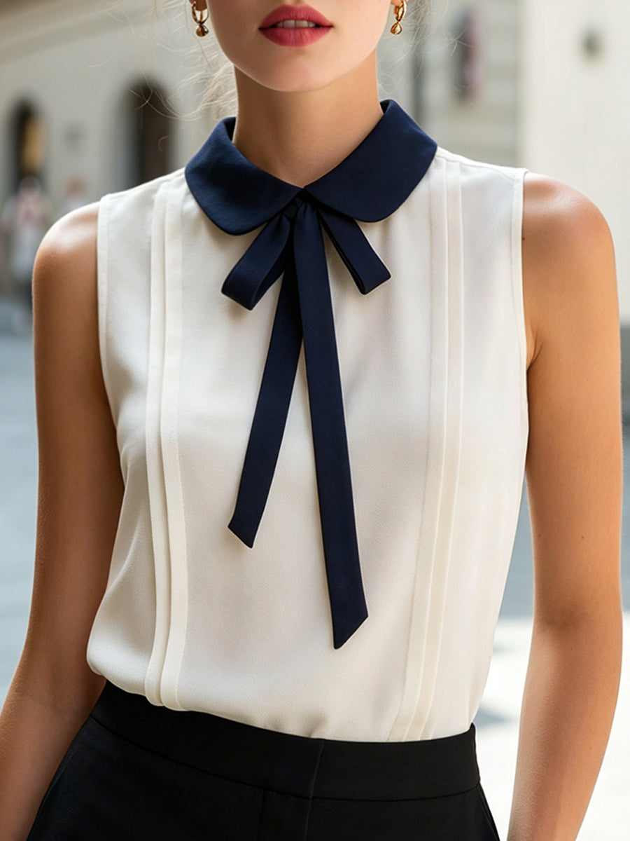Sleeveless Blouse With Navy Peter Pan Collar And Bow Tie