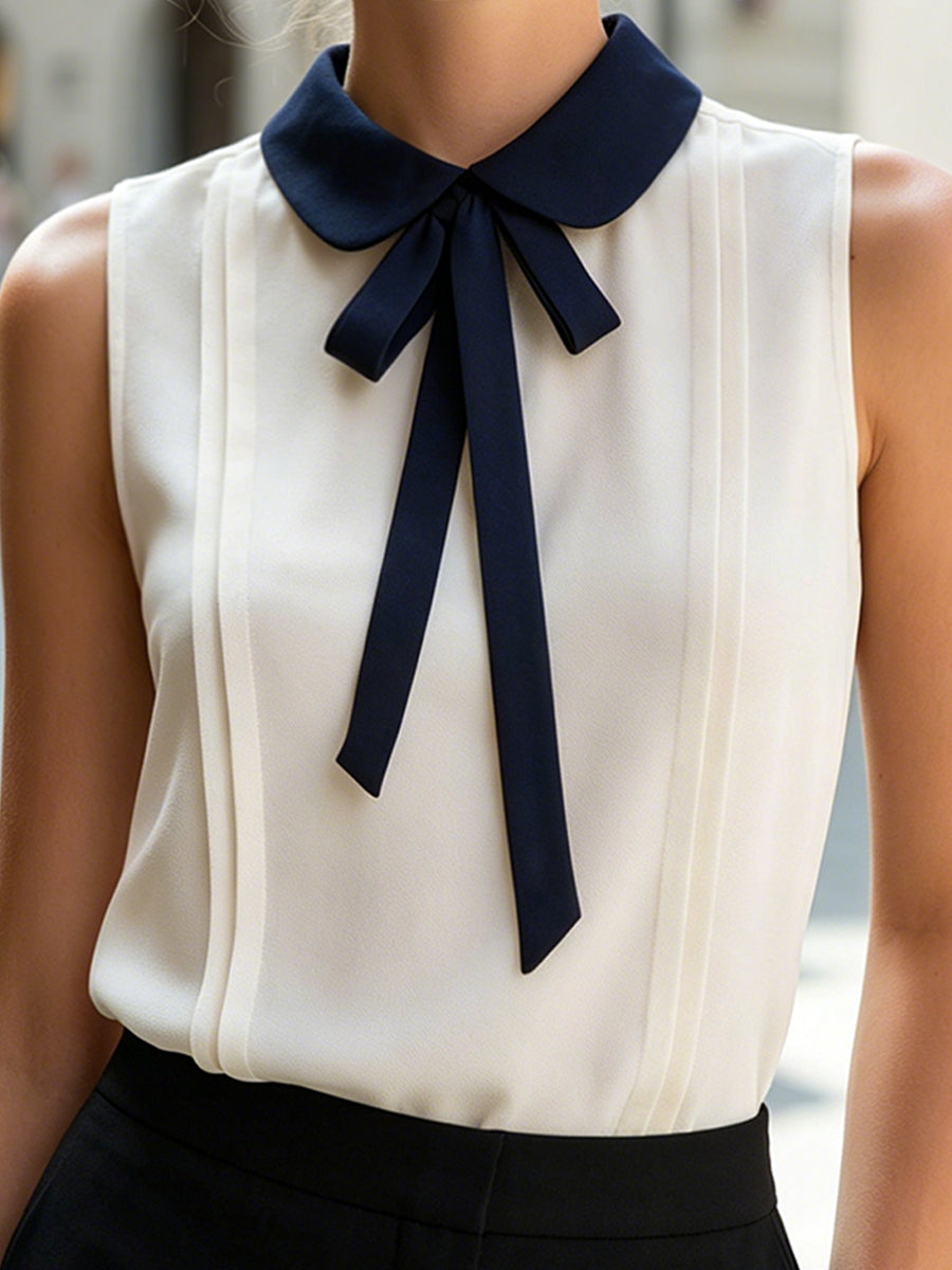 Sleeveless Blouse With Navy Peter Pan Collar And Bow Tie