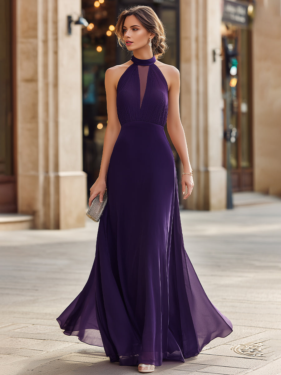 Pleated halter neck maxi dress with sheer panel and flowing silhouette