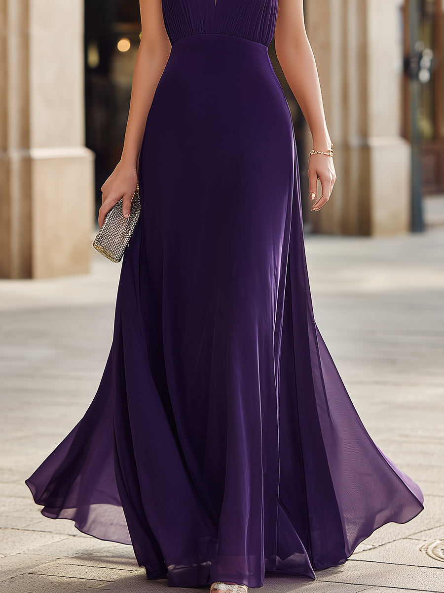 Pleated halter neck maxi dress with sheer panel and flowing silhouette